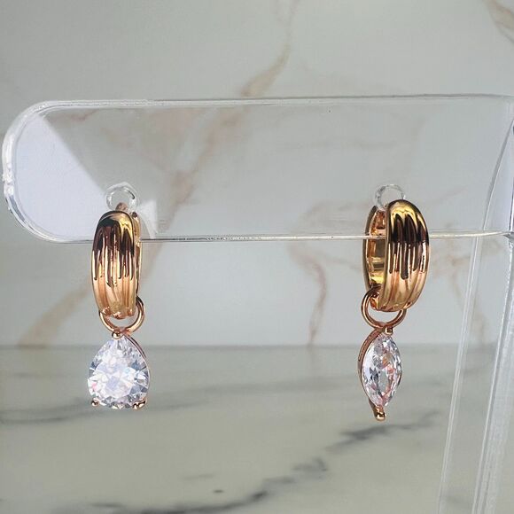 REVOLVE Luv AJ X Dezi Gold Huggies with Mismatched Prong-set Crystal Drops - Picture 3 of 5